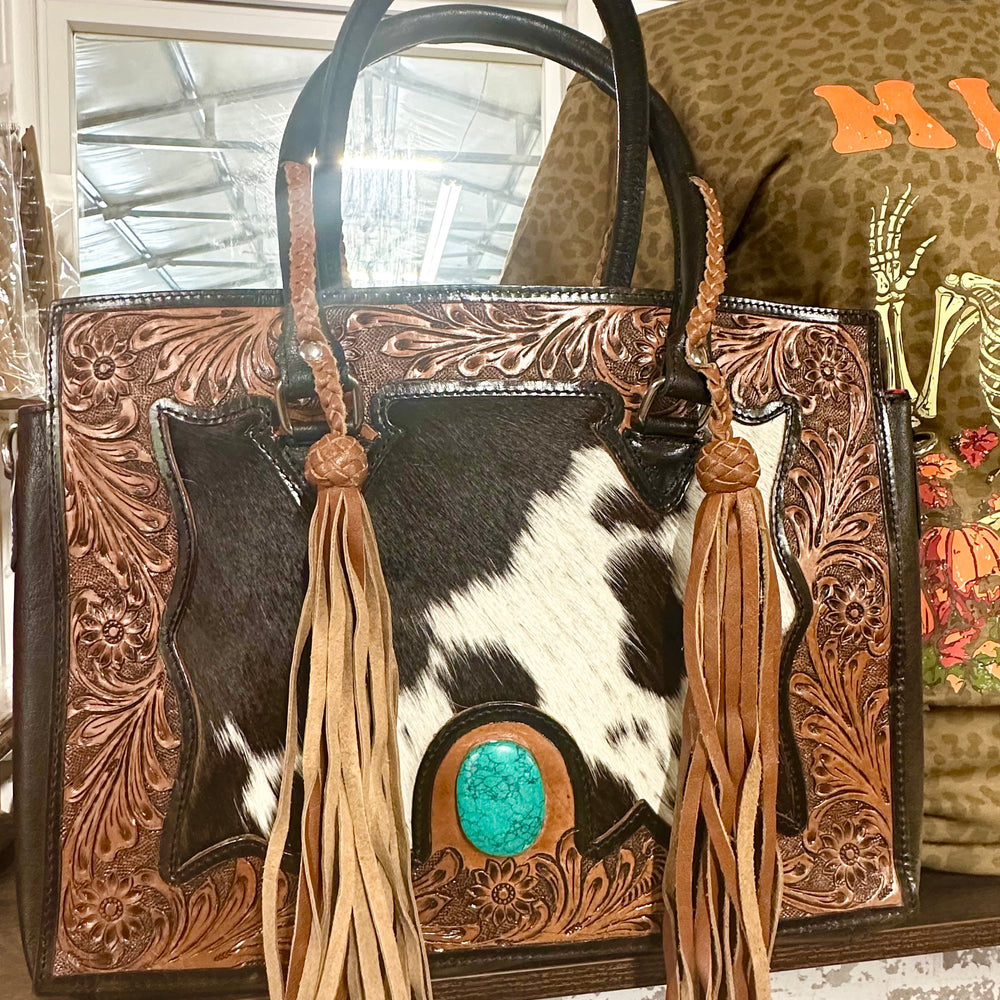 
                      
                        The Nashville Gunner Tooled Cowhide Tote Purse
                      
                    