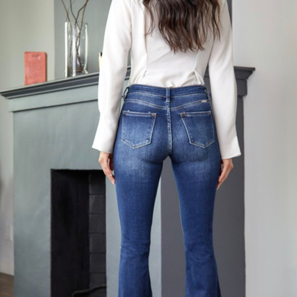 
                      
                        Mid Rise Distressed Button Fly Flare Jean
                      
                    